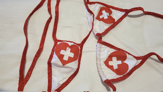 White w Red Nurse Heart Logos w Red Trim Medium Coverage Top Y Back Thong Slingshot 2 Piece Micro Bikini